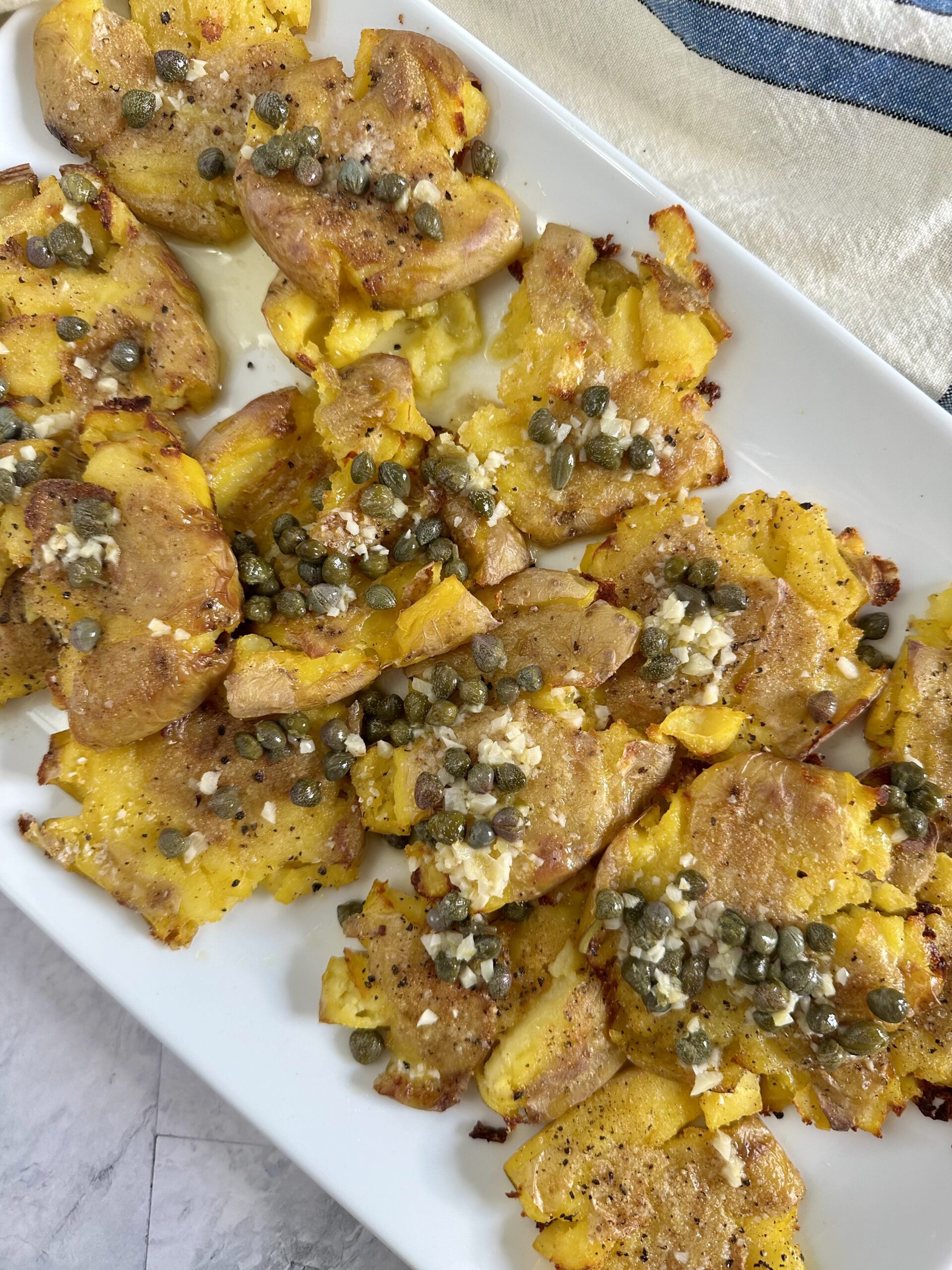 Smashed Potatoes with Garlic Caper Lemon Sauce • In the Kitchen with Steff